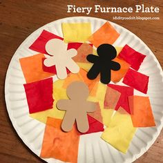 a paper plate with some cut out shapes on it