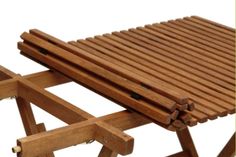 a close up of a wooden bench on a white background