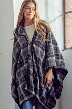 This throw-on-and-go wool poncho is made with a roomy hood and a toggle closure. Material: 50% wool 50% polyester Care: Dry clean only Made in USA Model is 5' 10" 33-24-37 Casual One-size-fits-all Wool Poncho, Vintage One-size Winter Poncho, Cozy Oversized Black Poncho, Plaid Winter Poncho, Bohemian Poncho For Cold Weather, One Size, Plaid Poncho, Blanket Shawl, Cocktail Dress Formal, Wool Poncho