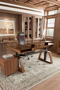 a wooden desk sitting on top of a rug