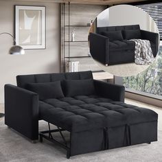 a black couch and ottoman in a living room