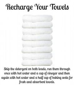 a stack of white towels with the words recharge your towels