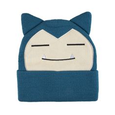 a blue knitted hat with a cat face on the front and eyes drawn in white