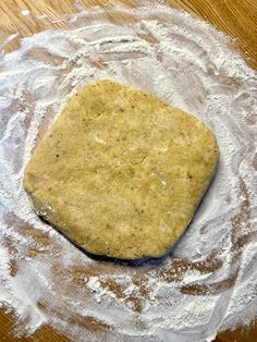 a piece of bread sitting on top of flour