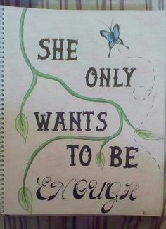 a notebook with the words she only wants to be enough written in cursive writing