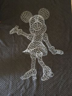 a black towel with a drawing of mickey mouse on it