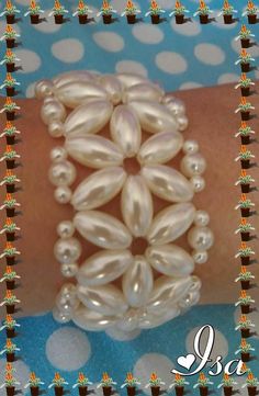 a woman's arm with a bracelet made out of pearls