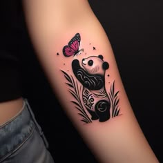 a panda bear tattoo with a butterfly on it