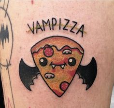 a close up of a person's leg with a tattoo on it that says, vampire pizza