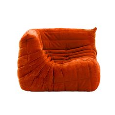 an orange chair sitting on top of a white floor