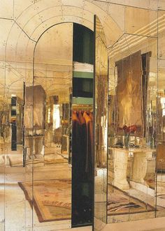 a large mirror reflecting the inside of a room