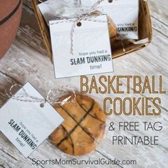 basketball cookies and free printable tags are on display in a basket next to a basketball