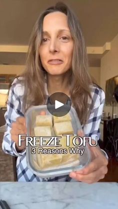 a woman holding a container with food in it and the caption freeze tofu 3 reason why