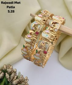 Description :- Gold plated Polki bangle pair/Statement Kada/Kundan Bangles/Bridal Bangle/Indian Wedding/Pakistani/Punjabi Gold Kada bangles /Indian bangles/Antique bangles/Temple Jewelry/Bridal Bangles/Indian Wedding/Pakistani Jewelry/South indian jewelry Gift yourself a royal look with this perfectly crafted necklace set from Manalisstudio. Crafted with high quality stones and pearls, it is impressive in design. The green enamel artwork adds perfect texture to the design. Perfect for weddings a Luxury Meenakari Bangle Bracelet, Luxury Round Bangle For Wedding, Luxury Yellow Bangle For Festivals, Luxury Traditional Meenakari Bracelets, Luxury Victorian Bangle For Wedding, Luxury Multicolor Bangle For Festive Occasions, Luxury Handmade Bangle For Festive Occasions, Gold Kundan Bracelet, Kundan Kada Design