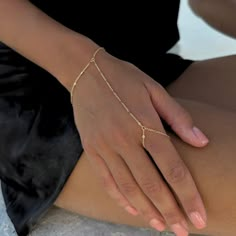 Our BEST SELLING hand chain is so flattering and comfortable to wear. Our 18K gold plated chain is sparkly and sits so beautifully on the hand. Layer with some of your favourite rings and bracelets. We have always been obsessed with hand chains so we created our own. Hand chains are so dainty and give that extra sparkle and shine to your hands. SILVER HAND CHAIN AVAILABLE HERE! - https://minkksi.etsy.com/listing/1104874189 MATCHING LARIAT/Y NECKLACE HERE! - https://minkksi.etsy.com/listing/17093 Minimalist Delicate Chain Bracelet For Party, Minimalist Gold Chain Bracelets For Party, Minimalist Gold Chain Bracelet For Party, Gold Dainty Chain Bracelet For Party, Minimalist Chain Ring For Parties, Delicate Chain Bracelet For Party, Delicate Adjustable Gold Chain Ring, Dainty Gold Chain Ring With Delicate Detail, Delicate Party Chain Bracelet