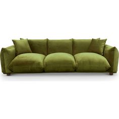 a green couch with four pillows on it's back and one arm facing the camera