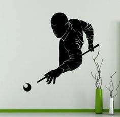 a black and white wall decal of a man hitting a ball with a bat