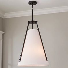 a light fixture hanging from the ceiling in a room