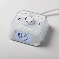 an alarm clock is plugged in to the charger for powering it up