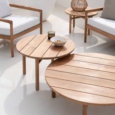 a bowl of cereal sits on a table next to two chairs and a coffee table