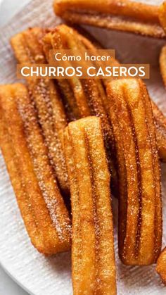 churros on a white plate with the words como hacer churros caseros