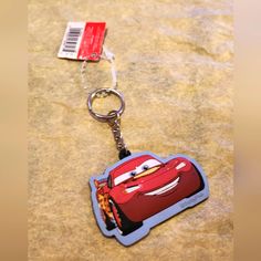 a disney pixar keychain with a tag attached to it