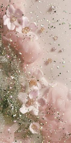 pink flowers and glitters on a white background