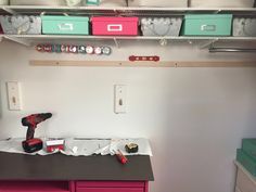 a workbench with tools and other items on it in a storage room area