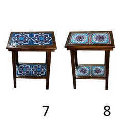 two side tables with blue and white tiles on the top, one is turned upside down