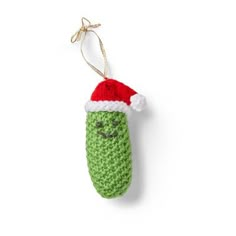 a crocheted ornament with a santa hat on it