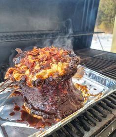 the meat is being cooked on the grill