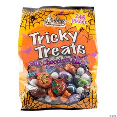 a bag of tricky treats filled with halloween candy