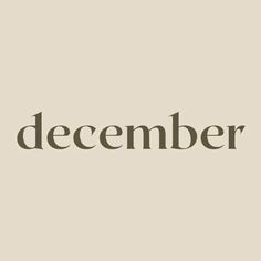 the word december written in black on a beige background