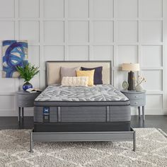 an image of a bedroom setting with mattresses and pillows on the side table in front of the bed