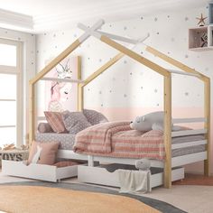 a child's bedroom with pink and white decor