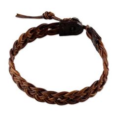 a brown braided leather bracelet on a white background