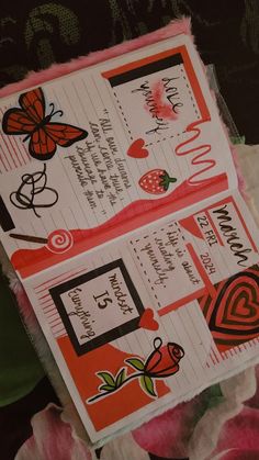 two valentine's day cards with hearts and butterflies on them sitting next to each other