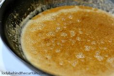 a frying pan filled with food on top of a stove