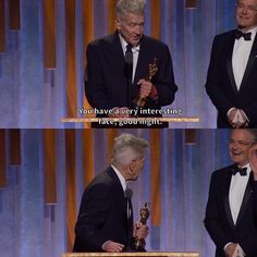 two men in tuxedos holding their oscars and laughing at each other while standing on stage