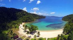 an aerial view of a tropical beach and lagoon