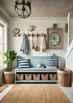 a blue bench sitting in the middle of a room next to some baskets and hooks