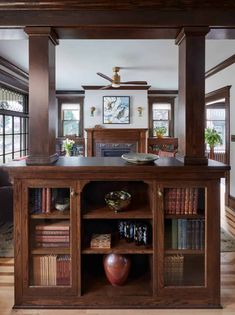 an open bookcase in the middle of a living room