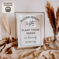 there is a sign that says loving memory plant these seeds in loving memory on the bed