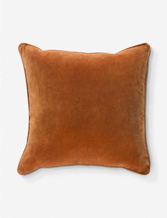 a brown pillow on a white background