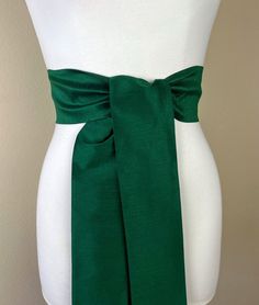 "Wide Textured Alpine Green Sash Belt  Green Dupioni Sash  Dark Green Dress Sash  Dupioni Belt  Green Wedding & Bridesmaid Sash  Satin Swank  Add rich color and texture to your special occasion outfit with this Satin Swank® dupioni sash belt. Depending on your waist size and the length you choose (75 and 90 inch lengths available), you can wrap this sash around your waist once or twice. You decide whether to tie the sash in a bow or a simple knot with long-hanging tails. Tie in front, in back, or on the side. A double layer of textured dupioni fabric in Alpine green. Sash is the same front and back with seams hidden within the fold lines and ends finished on the angle. Dupioni features a rustic weave with naturally occurring slubs running throughout the fabric resulting in exquisite depth, Elegant Fitted Sashes With Tie Back, Elegant Fitted Sash With Tie Back, Fitted Bridesmaid Sash, Elegant Fitted Green Sashes, Fitted Tie Back Sash For Evening, Fitted Evening Sash With Tie Back, Formal Fitted Sash With Tie Back, Formal Fitted Sash With Tie Waist, Elegant Fitted Tie-waist Sash