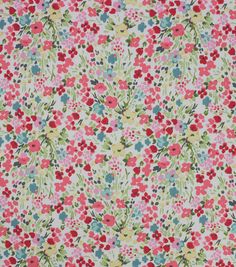 a floral print fabric with red, green and blue flowers