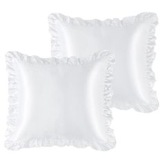 two white pillows with ruffled edges