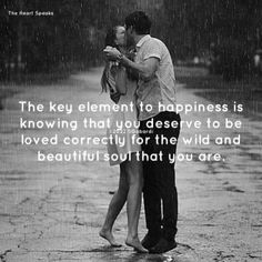 a man and woman kissing in the rain with an inspirational quote on it that reads, the key element to happiness is