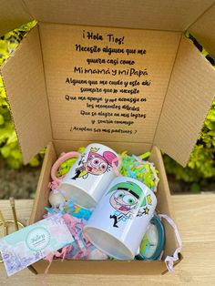 a box filled with baby items on top of a wooden table