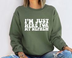 "Im Just Here For My Nephew Sweatshirt, Gift For Aunt Hoodie, Cute Aunt Gift From Nephew, New Future Aunt Apparel, Funny Aunt Life Clothing - - - - - HOW TO ORDER - - - - - -  1 - Please check the size and color charts. 2 - Choose your item and its size from the first scroll down menu. 3 - Choose the color of your item from the second scroll down menu. 4 - Add your personalized design color in the box if provided. 6 - Click \"Add to cart\". For multiple order, go back and repeat these steps. - - Aunt Goals, Auntie Things, Aunt And Nephew, Auntie Life, Puff Vinyl, Auntie Era, Etsy Wishlist, Baby Niece, Mom Of Boys Shirt